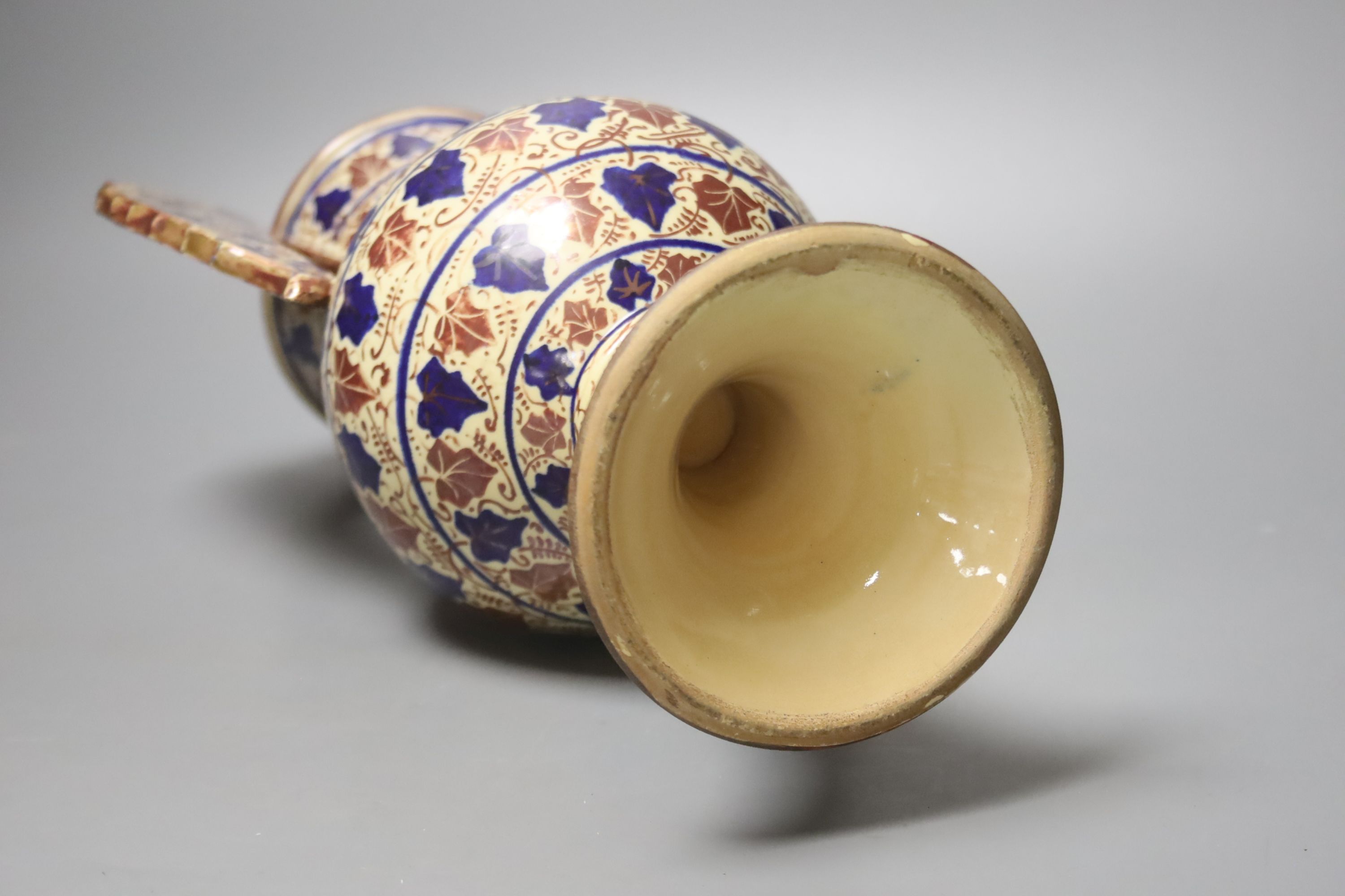 A Persian copper lustre two handled vase